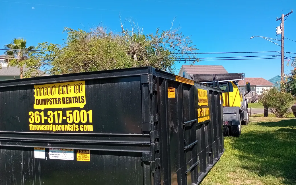 Dumpster rental filled with yard waste and storm debris in Corpus Christi