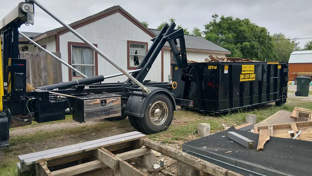 Construction and renovation debris loaded in a Corpus Christi roll-off dumpster